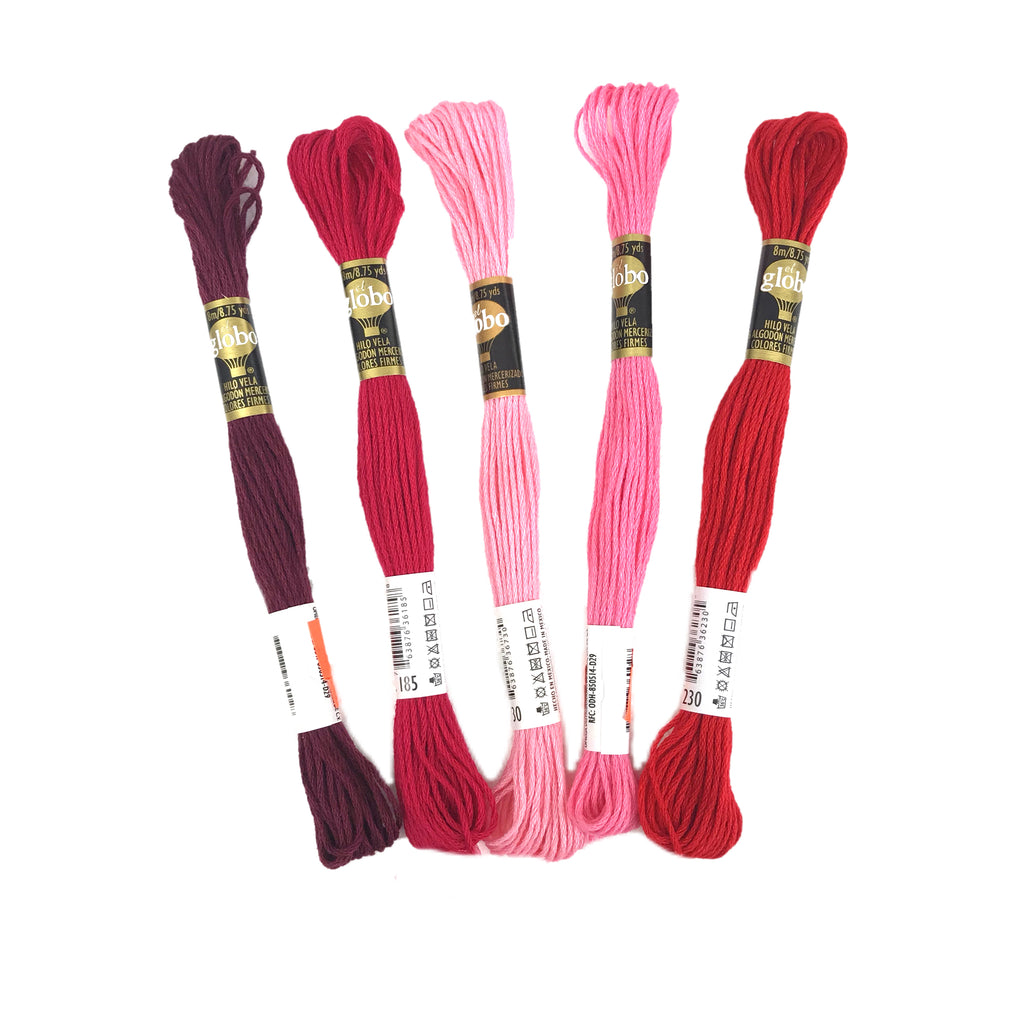 Hilazas para bordar de tonos rosas y rojos